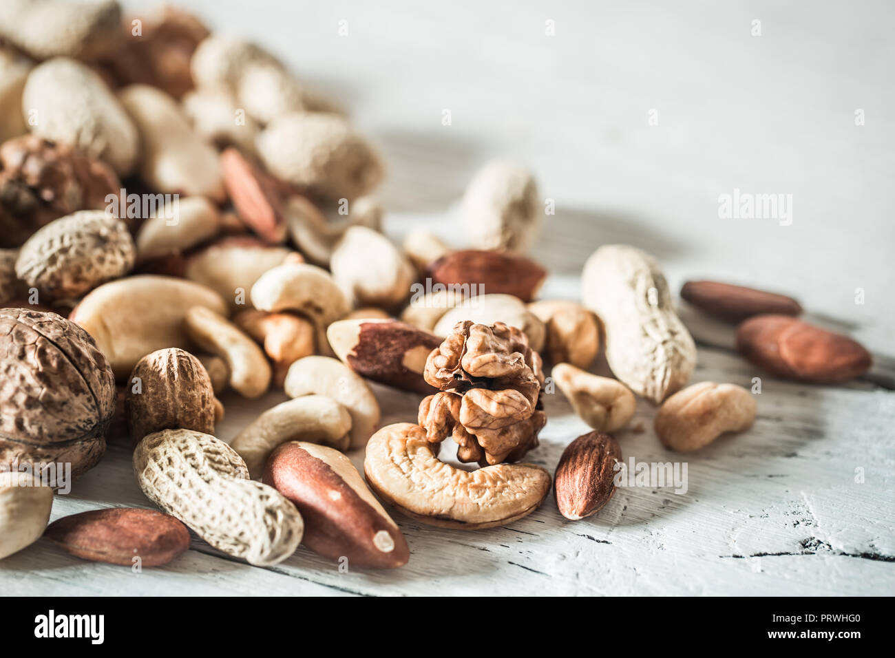 different nuts closeup on wooden background ,concept of healthy ...