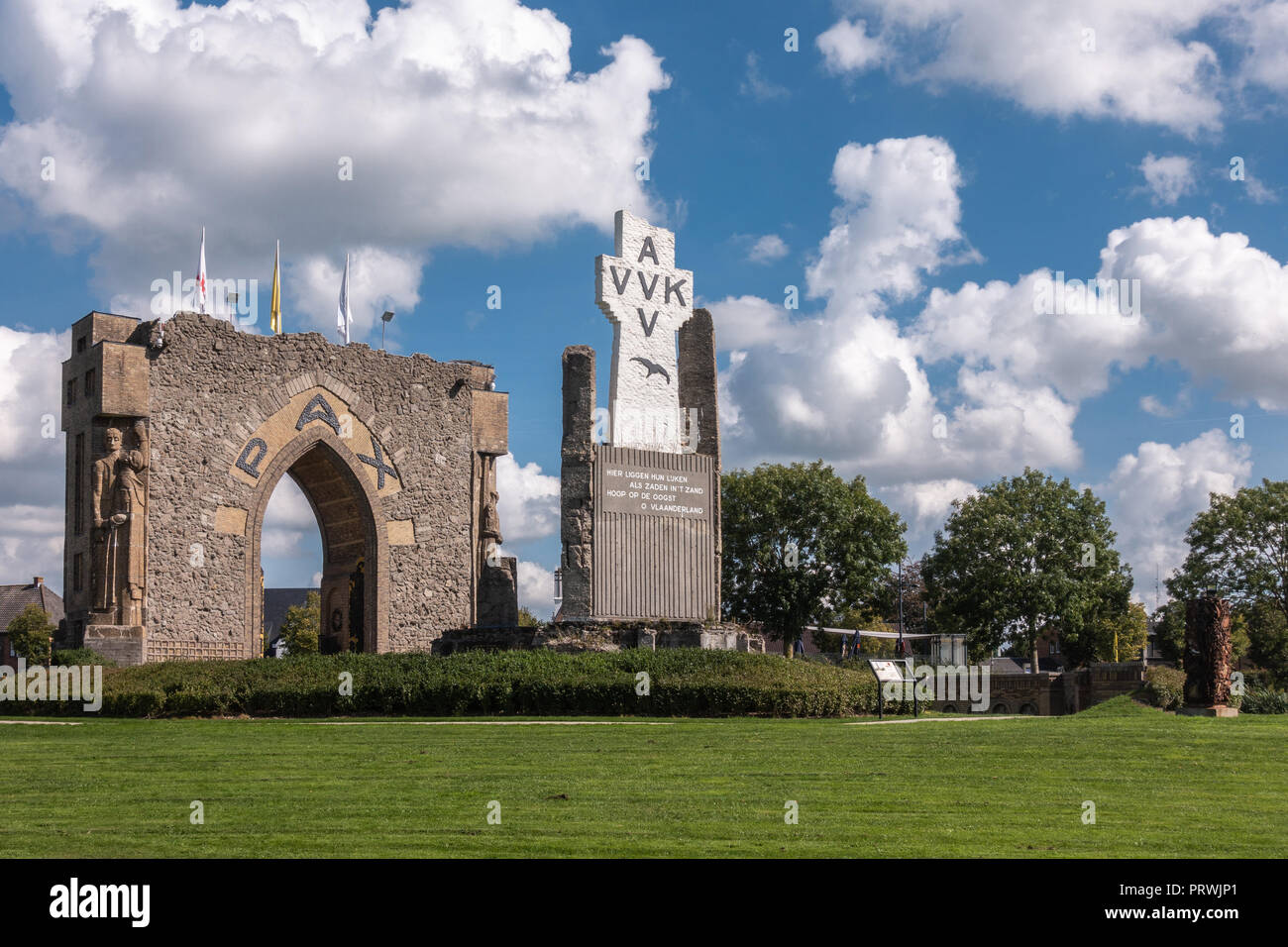 Diksmuide, Flanders, Belgium - September 15, 2018: PAX Gate and crypt ruin at IJzertoren plain. Gray and brown stones, AVV-VVK symbol on white cross,  Stock Photo