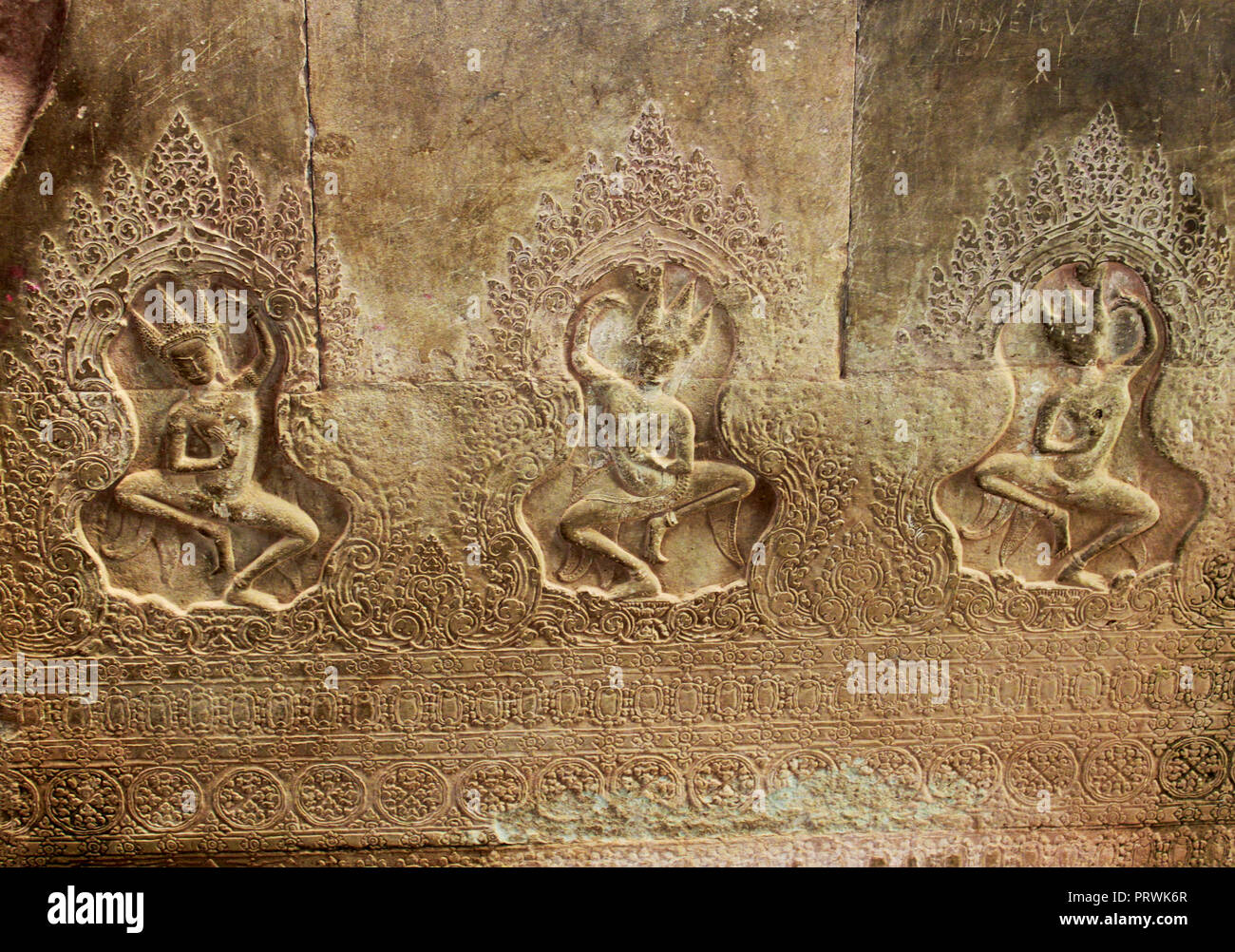 Buddha cravings on the wall of the Angkor Wat Temple in the Angkor Area, near Siem Reap, Cambodia, Asia. Buddhist monastery from the 12th century. Stock Photo