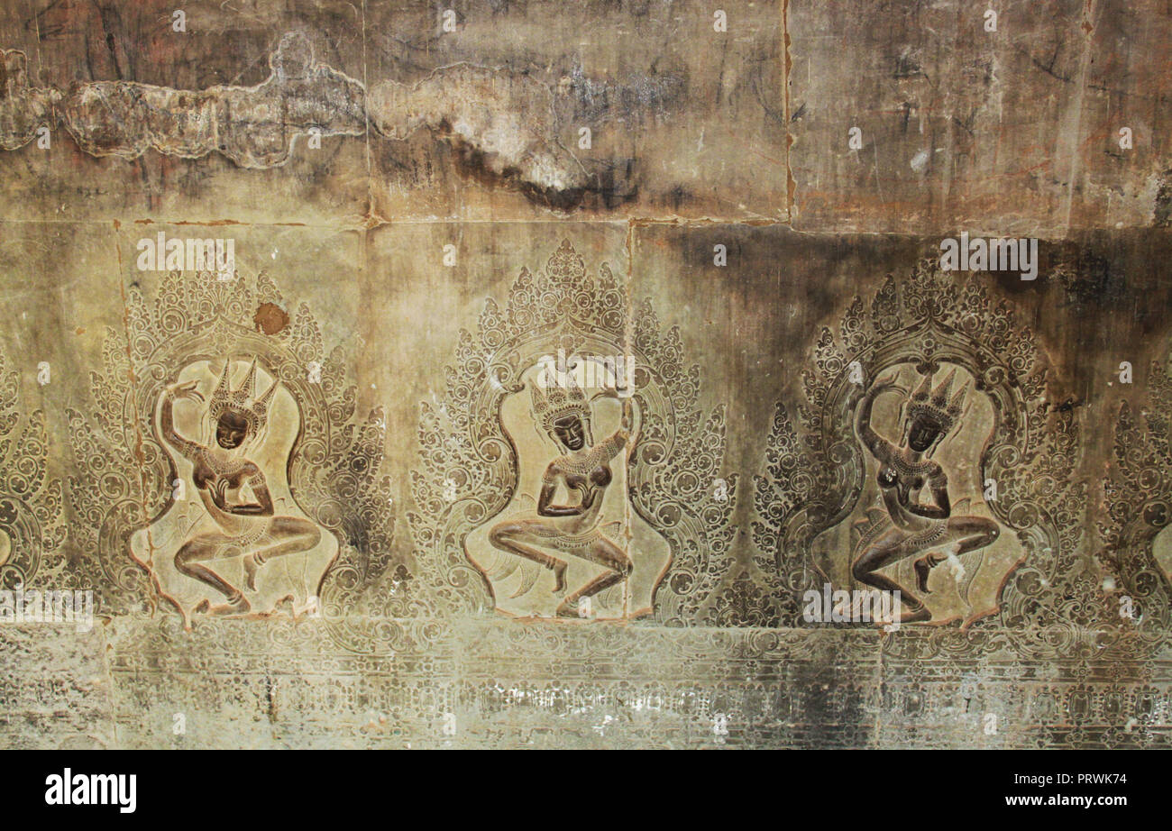 Buddha cravings on the wall of the Angkor Wat Temple in the Angkor Area, near Siem Reap, Cambodia, Asia. Buddhist monastery from the 12th century. Stock Photo