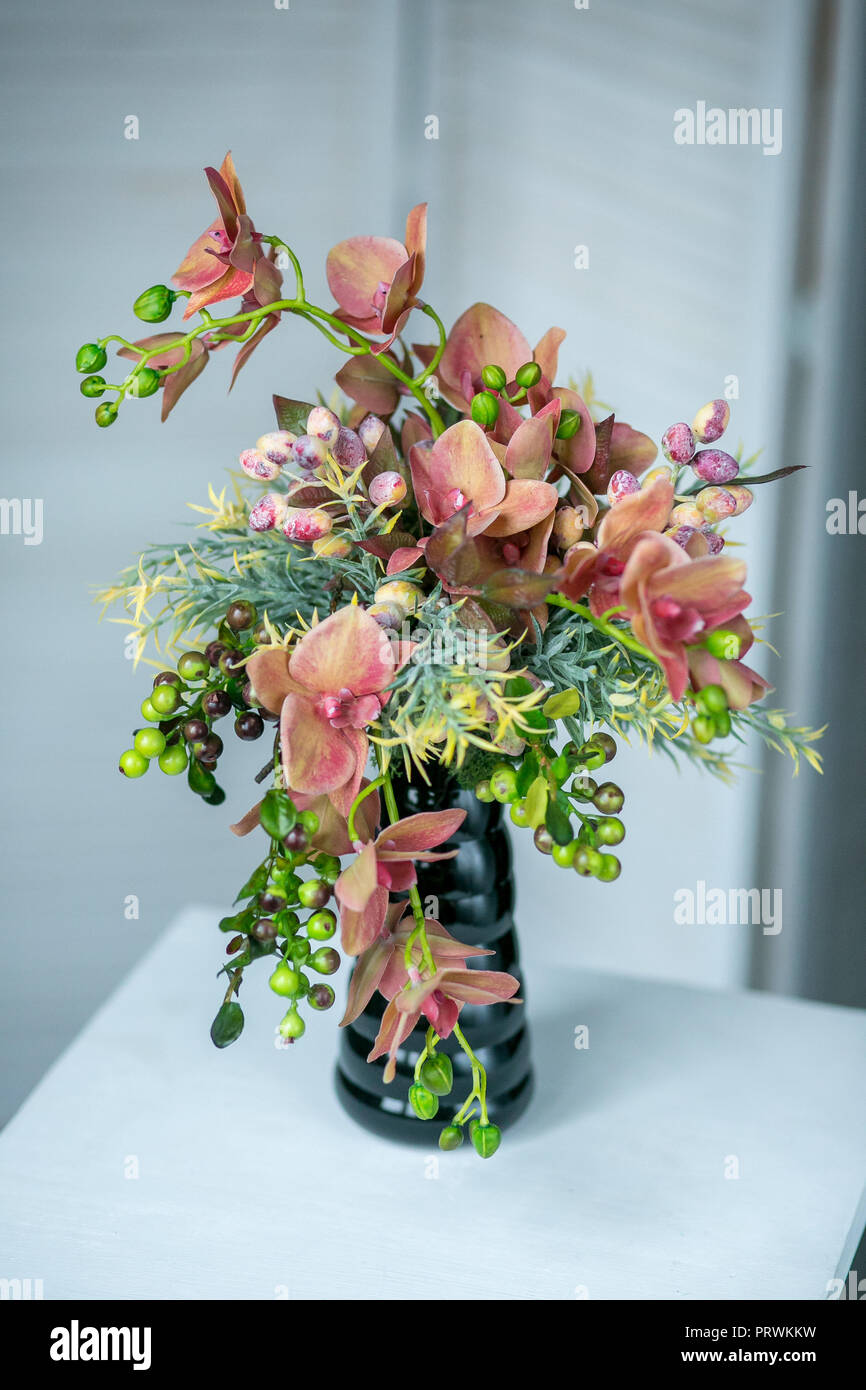 Still life with Bouquet of summer flowers in basket Stock Photo - Alamy