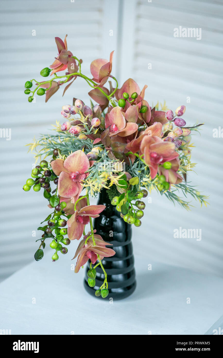 Still life with Bouquet of summer flowers in basket Stock Photo - Alamy