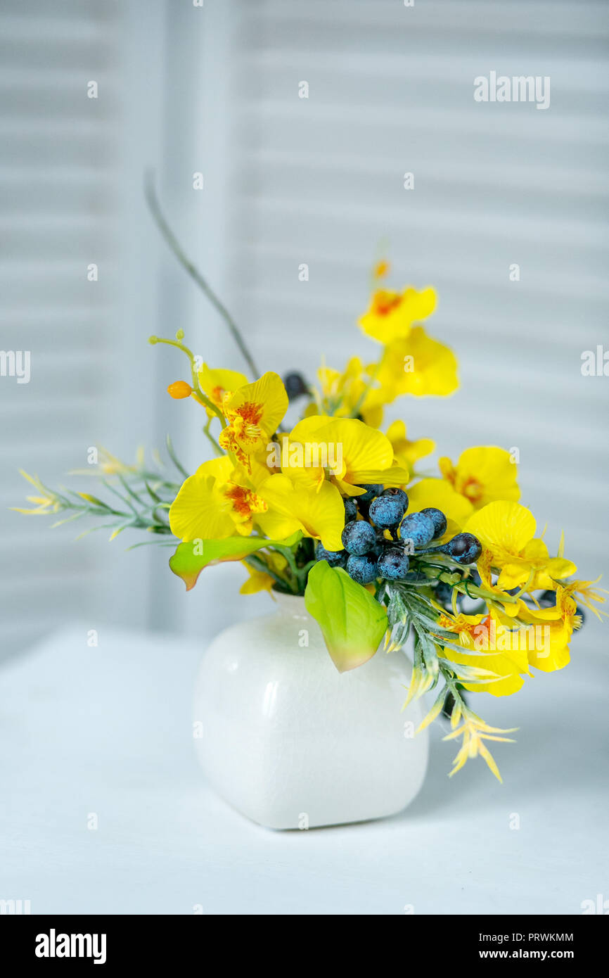 Still life with Bouquet of summer flowers in basket Stock Photo - Alamy