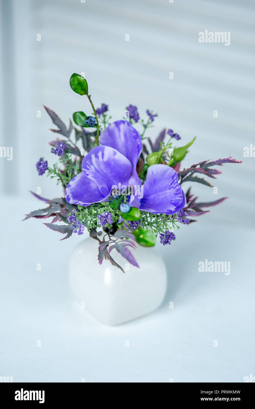 Still life with Bouquet of summer flowers in basket Stock Photo - Alamy