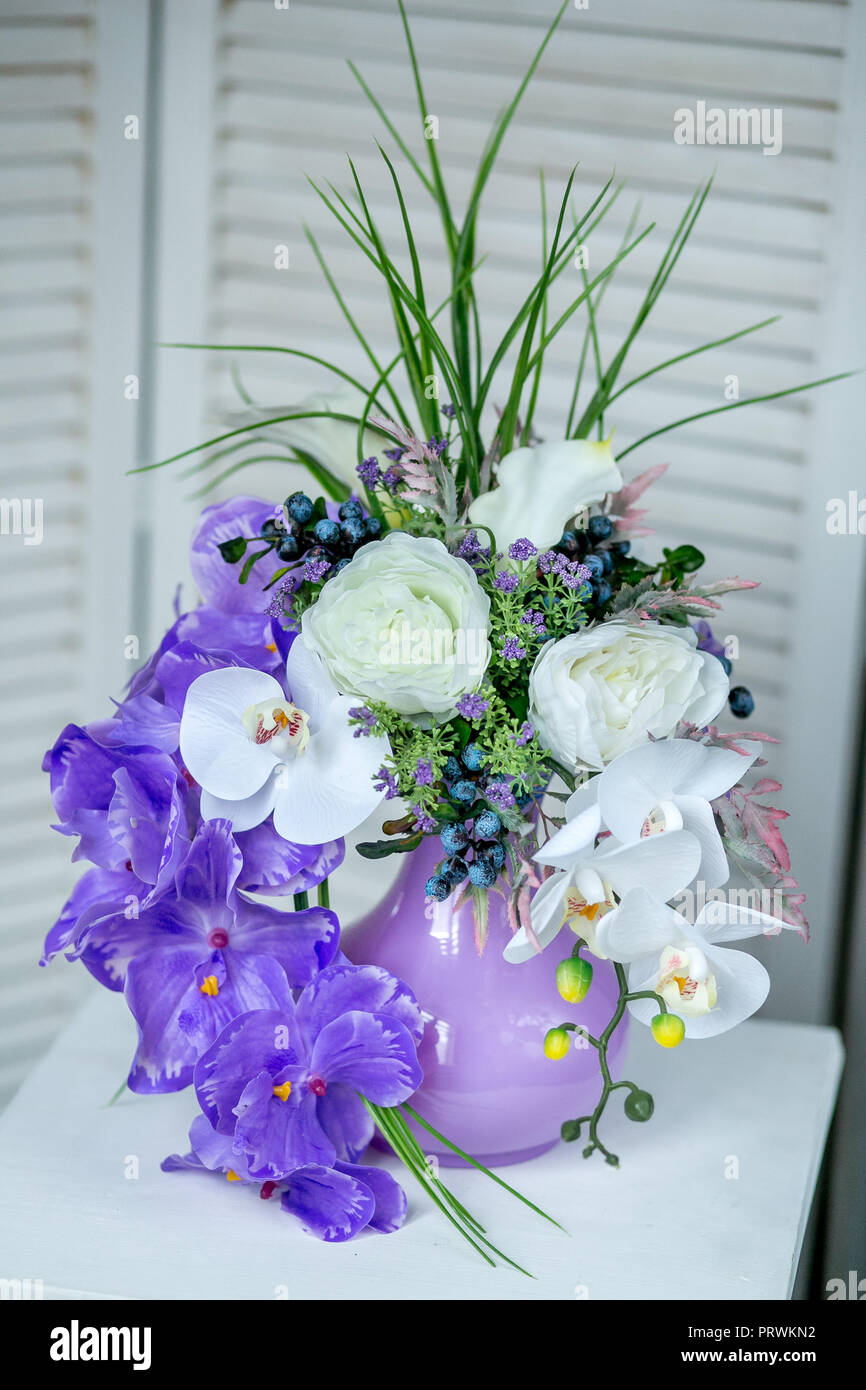 Still life with Bouquet of summer flowers in basket Stock Photo - Alamy