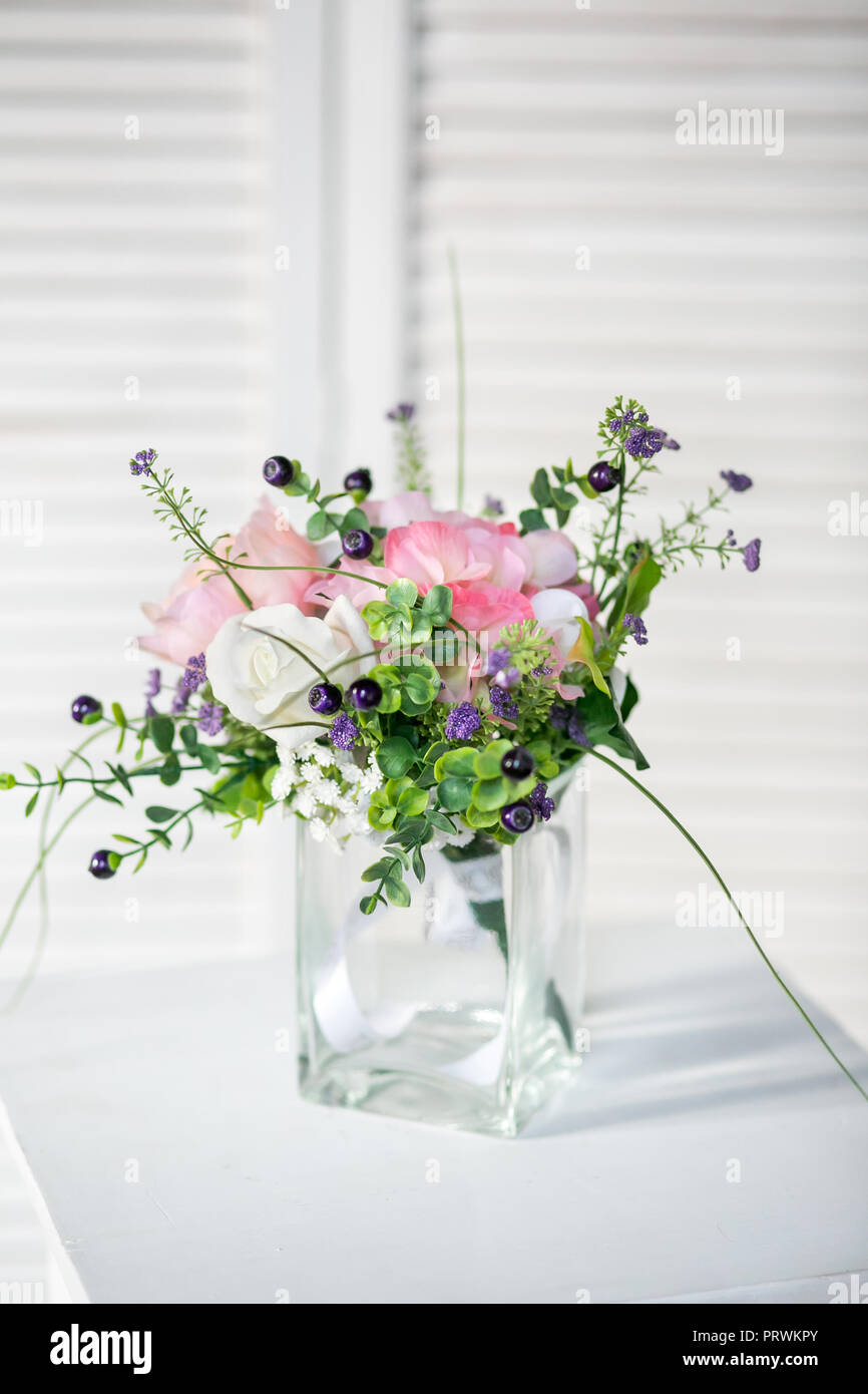 Still life with Bouquet of summer flowers in basket Stock Photo - Alamy