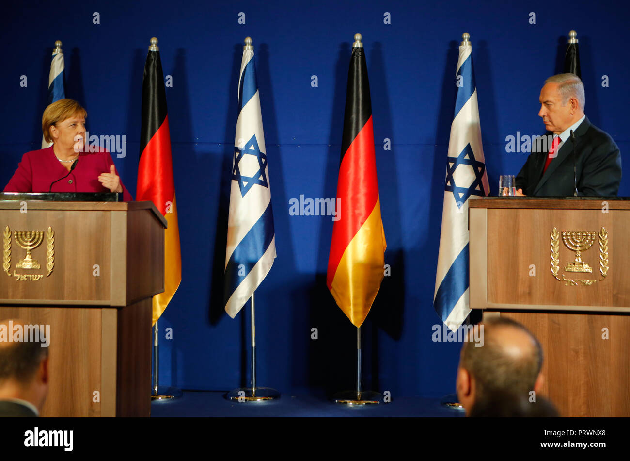 Jerusalem. 4th Oct, 2018. German Chancellor Angela Merkel (L) and Israeli Prime Minister Benjamin Netanyahu (R) attend a joint press conference in Jerusalem, on Oct. 4, 2018. Credit: Gil Cohen Magen/Xinhua/Alamy Live News Stock Photo