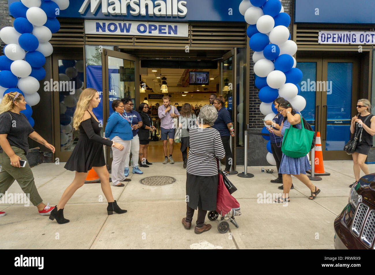 New York, USA. 4th October, 2018. Customers outside the brand new off-price Marshalls store in the Lower East Side neighborhood of in New York during it's grand opening on Thursday, October 4, 2018. Marshalls is a brand of the TJX Companies, parent of Marshalls, T. J. Maxx, HomeGoods and other brands. TJX Companies recently reported comps that grew 6% over year citing increased traffic in its Marmaxx division (Marshalls, TX Maxx). (Â© Richard B. Levine) Credit: Richard Levine/Alamy Live News Stock Photo