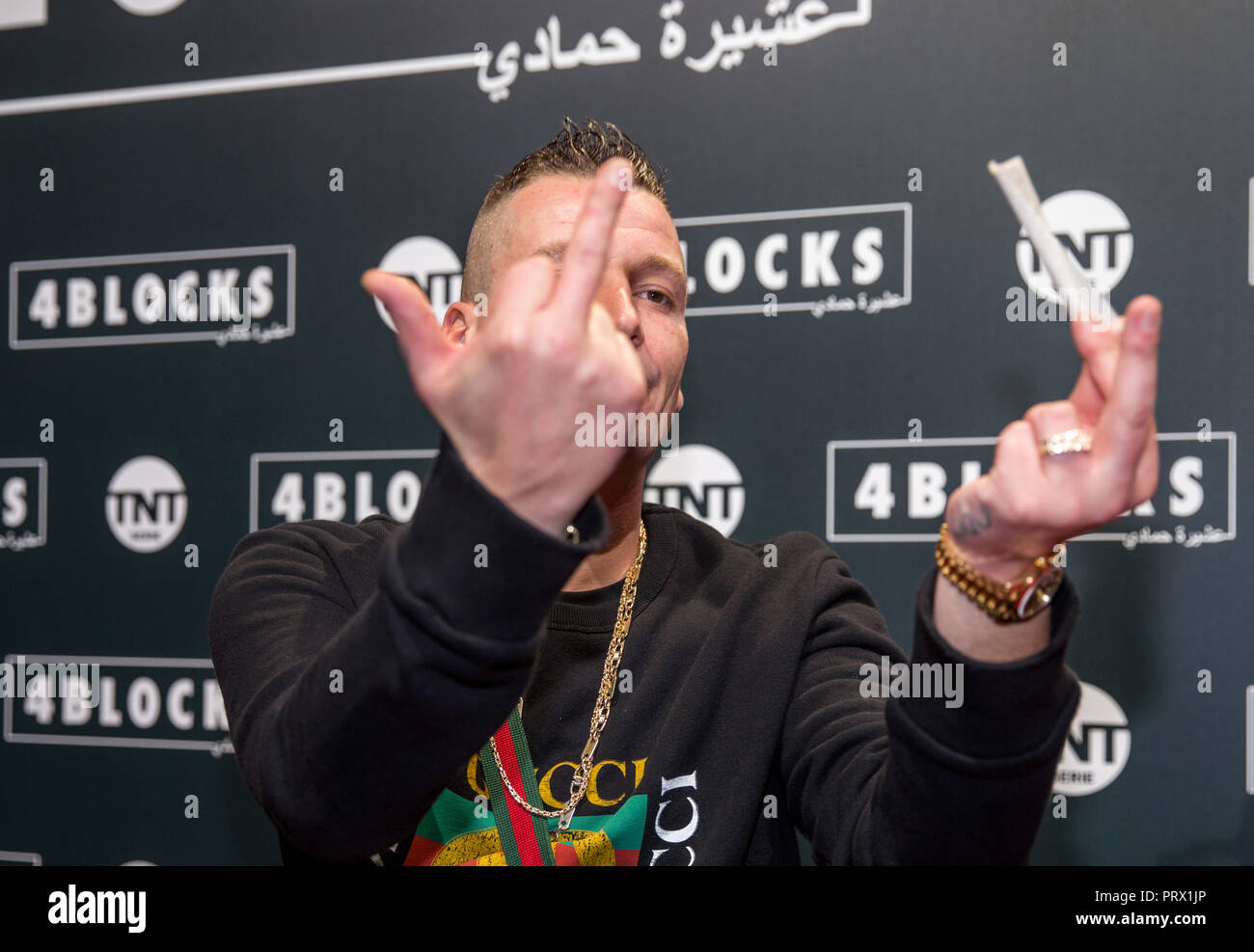 04 October 2018, Berlin: Rapper LX on the red carpet for the premiere ...