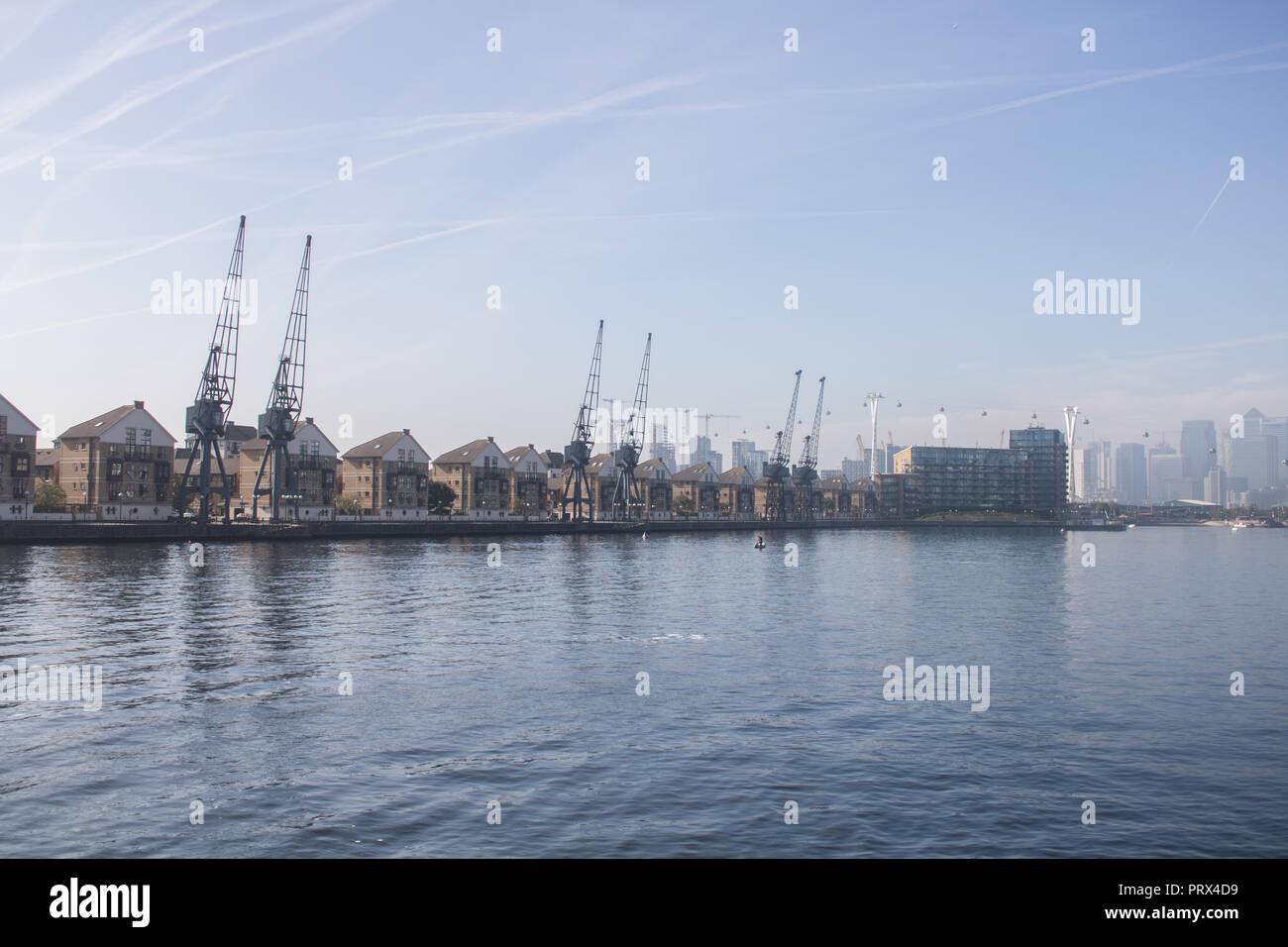 London UK. 5th October 2018. The disused cranes at the Royal Victoria Docks rise in the autumn sunshine after the early morning fog clears Credit: amer ghazzal/Alamy Live News Stock Photo