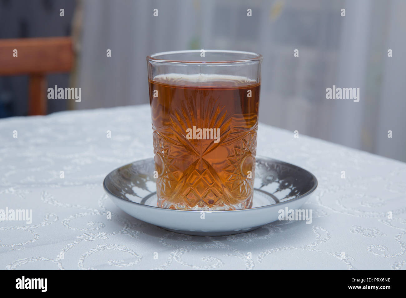 Azerbaijan tea in traditional glass on tray closeup Stock Photo