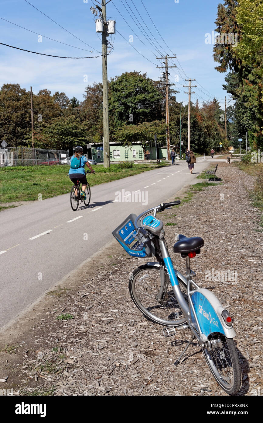 A Mobi Bike Share bicycle parked on the Arbutus Greenway corridor in Vancouver, BC, Canada Stock Photo