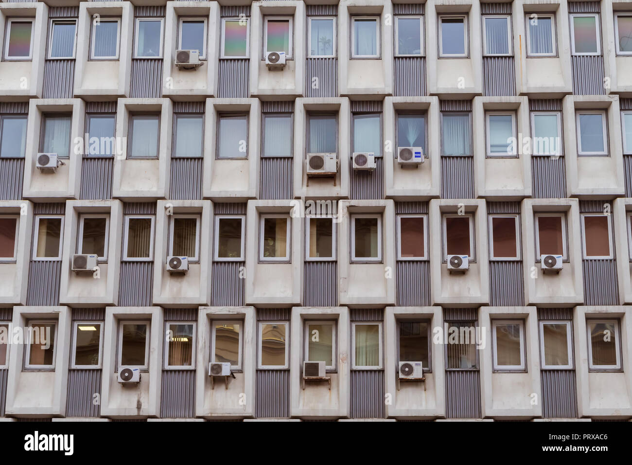 Air conditioners mounted on a wall of a soviet era office building in Moscow, Russia Stock Photo