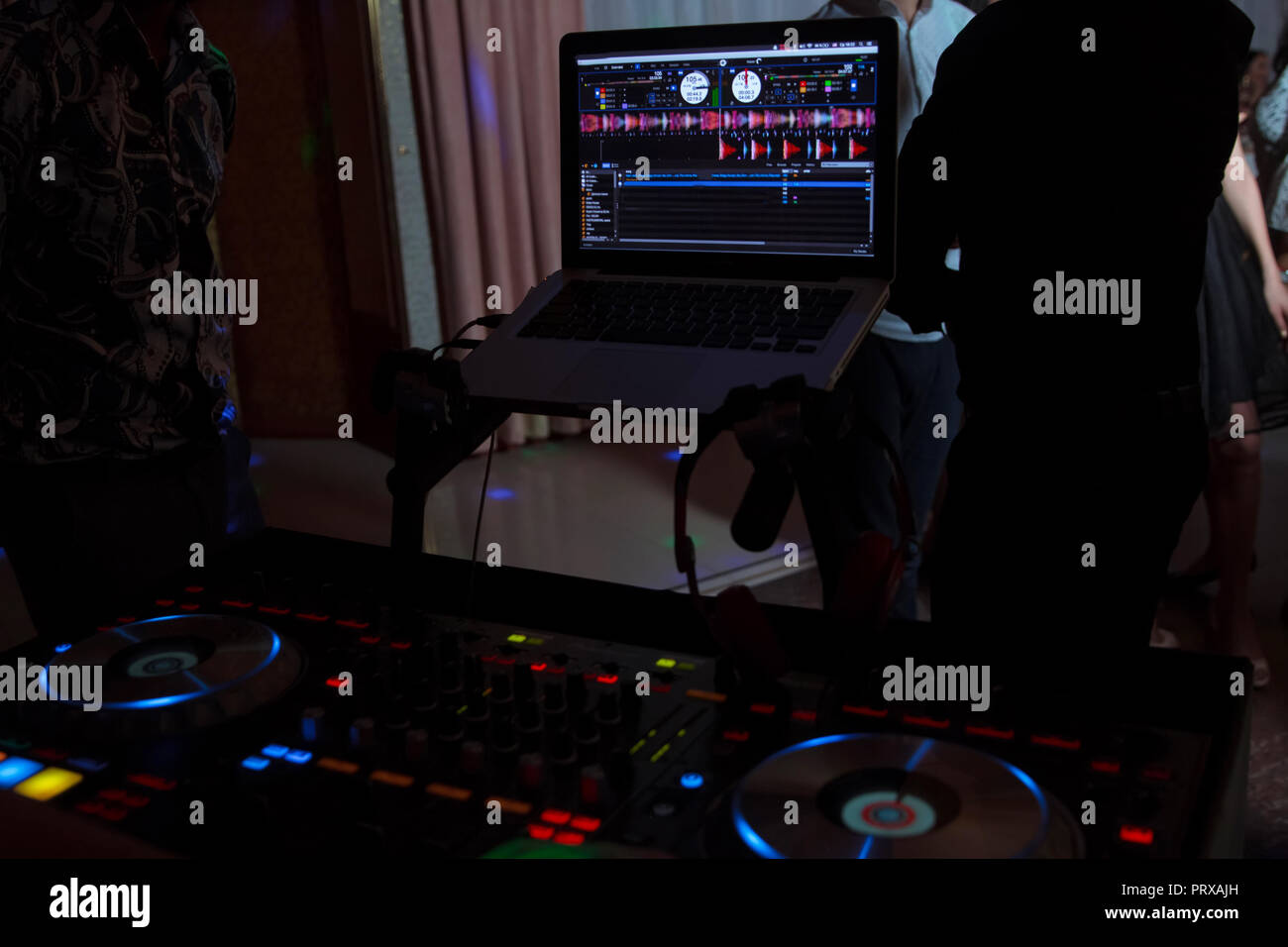 Party dj audio equipment on scene in club.Bright concert lighting.Disc