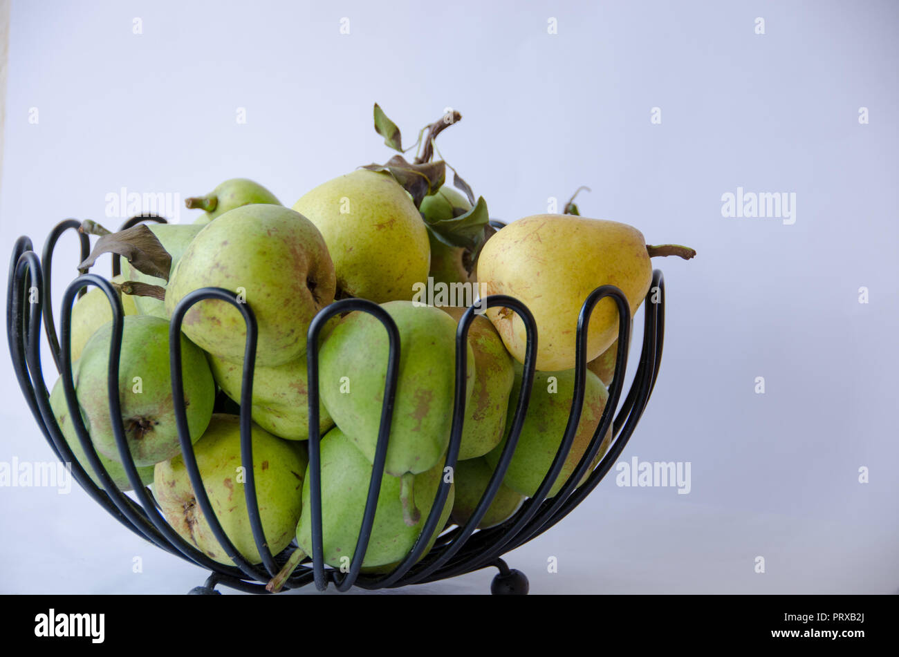 A group of handpicked pears during autumn in a decorative fruitbowl Stock Photo