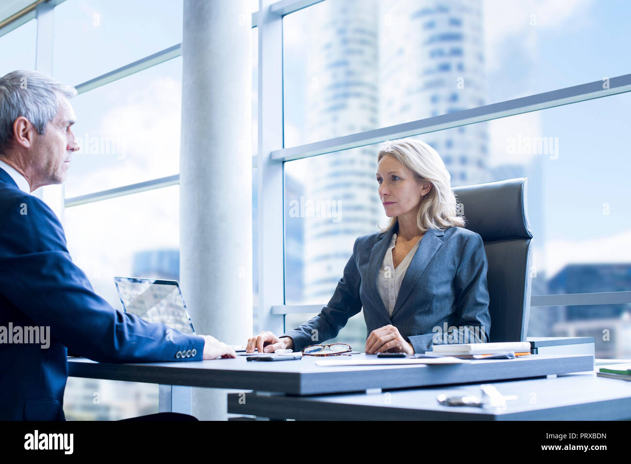 Business people sitting in office Stock Photo - Alamy