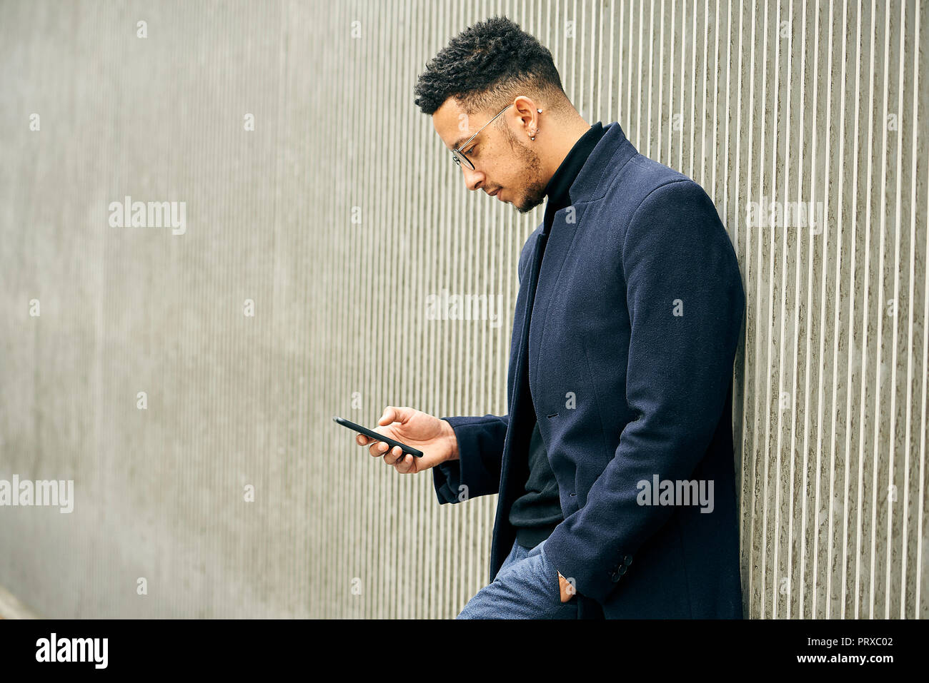 Side view of businessman using smartphone Stock Photo