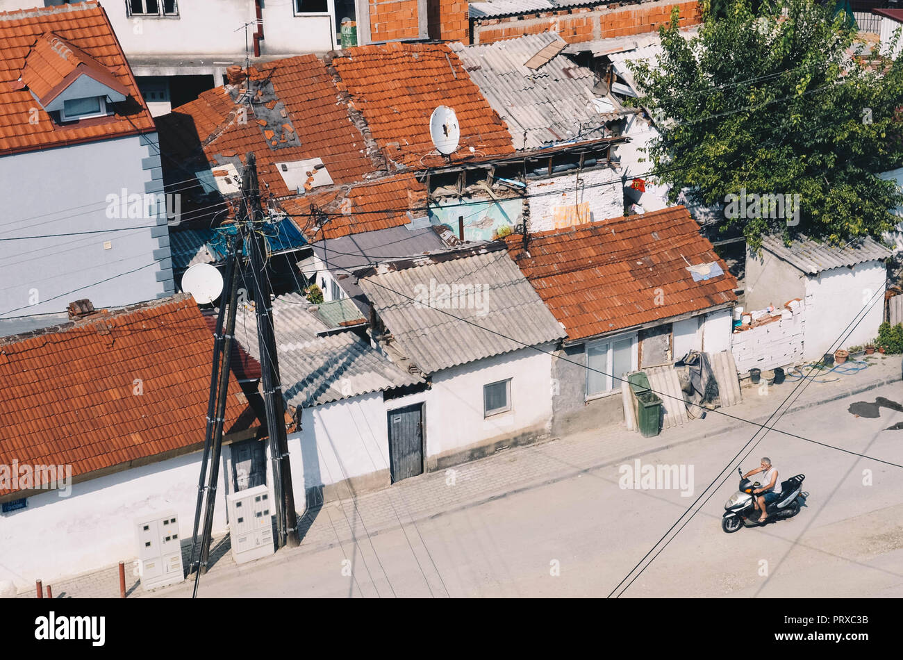 A man rides a motorbike through inner city Skopje, Republic of Macedonia, September 2018 Stock Photo