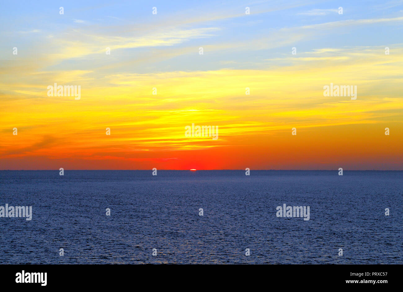Autumnal sunset, blue sea, The Wash, from Hunstanton, Norfolk, red sky, skies Stock Photo
