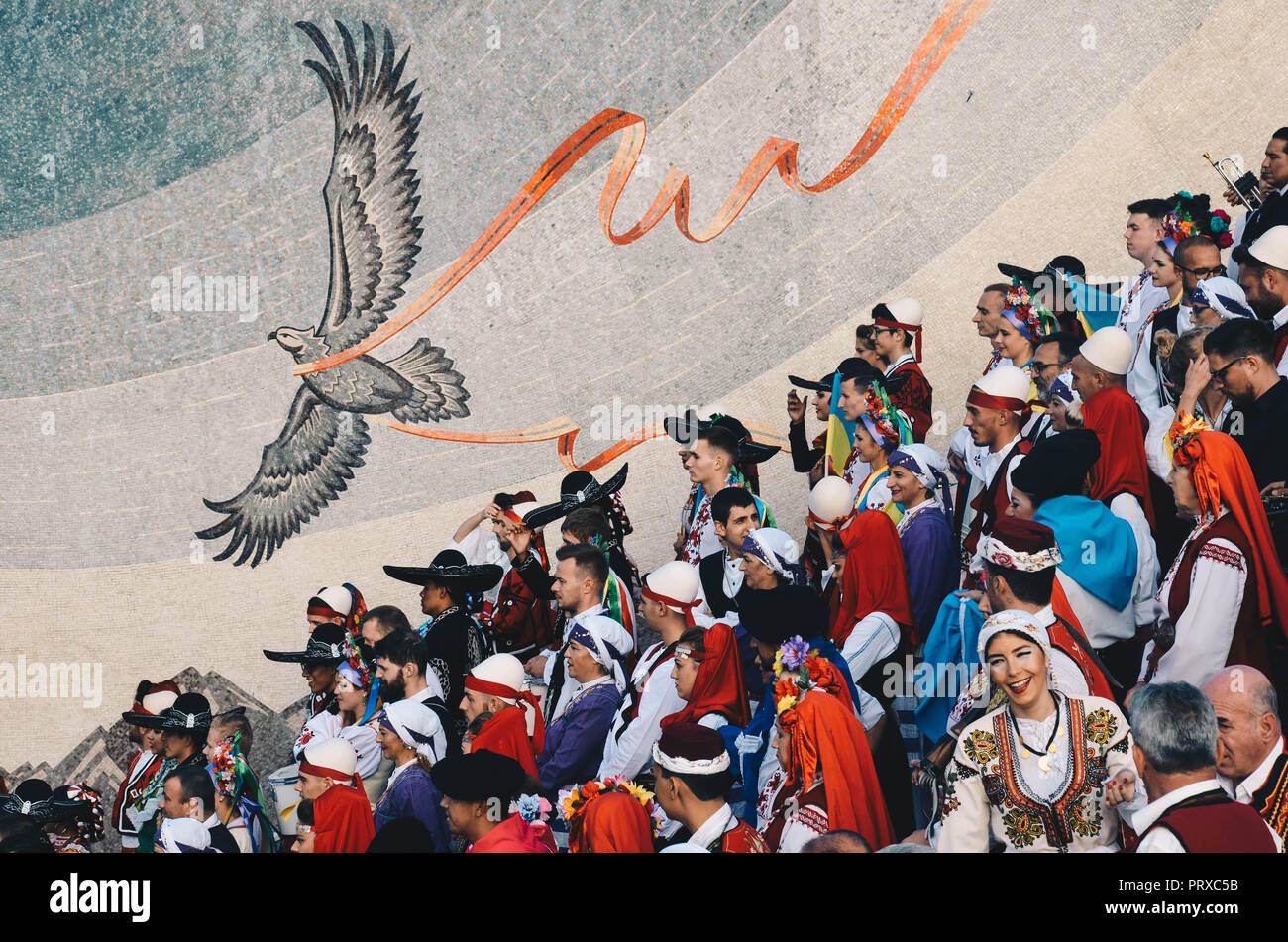 A group of people in traditional regional dress performing in central Skopje, Republic of Macedonia, September 2018 Stock Photo