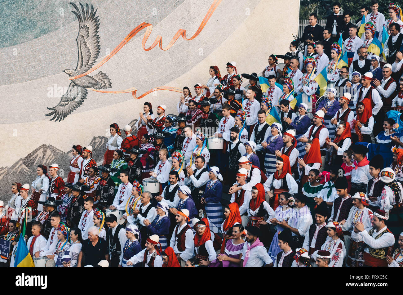 A group of people in traditional regional dress performing in central Skopje, Republic of Macedonia, September 2018 Stock Photo