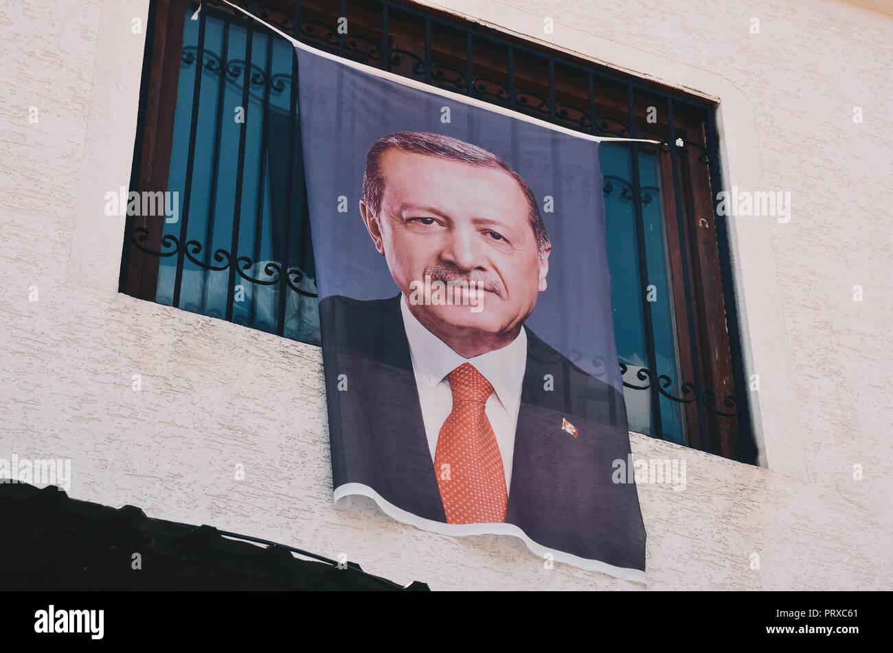 A portrait of Turkish president Recep Tayyip Erdoğan hanging from a house and shop, Old Bazaar, Skopje, Republic of Macedonia, September 2018 Stock Photo