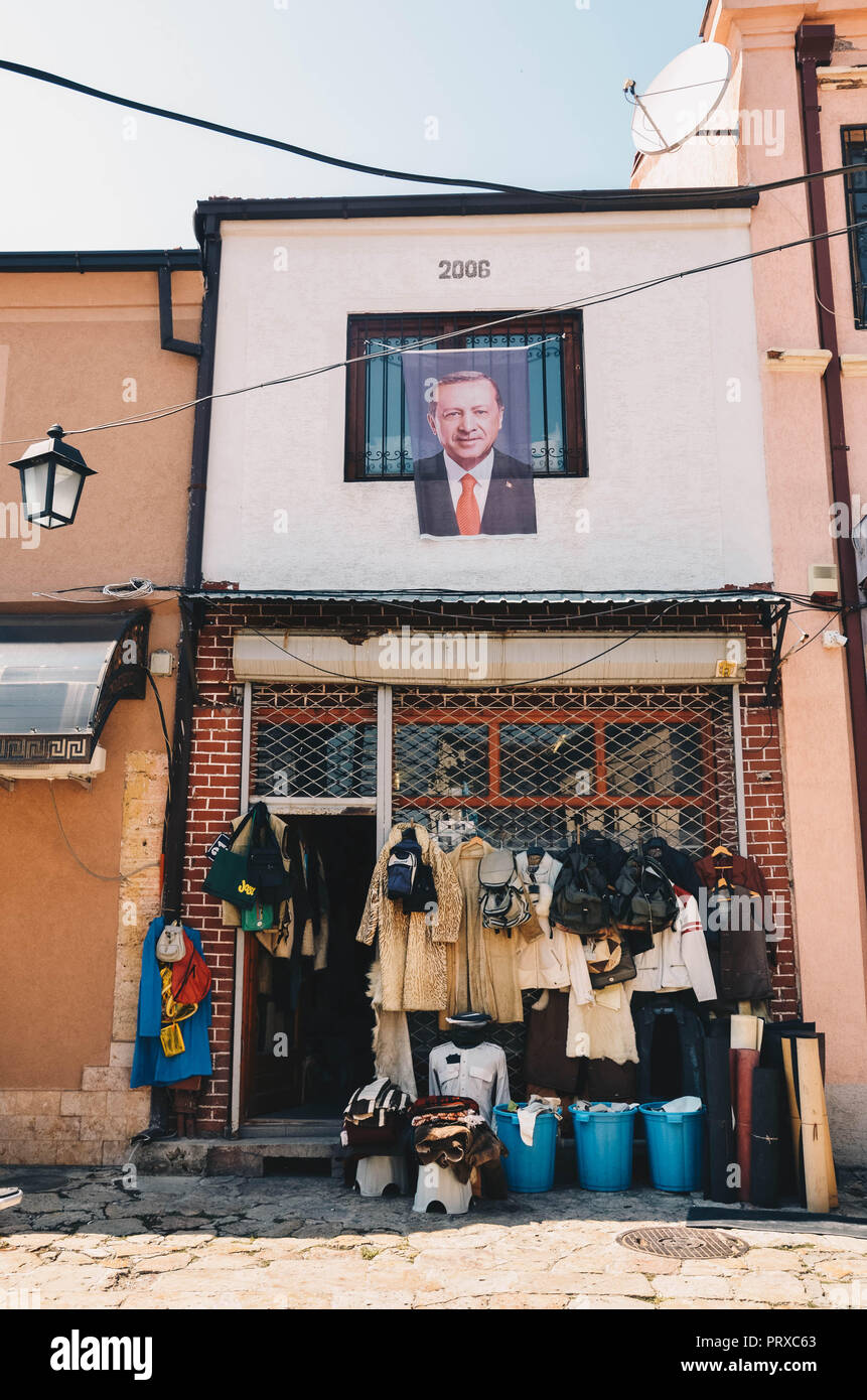A portrait of Turkish president Recep Tayyip Erdoğan hanging from a house and shop, Old Bazaar, Skopje, Republic of Macedonia, September 2018 Stock Photo