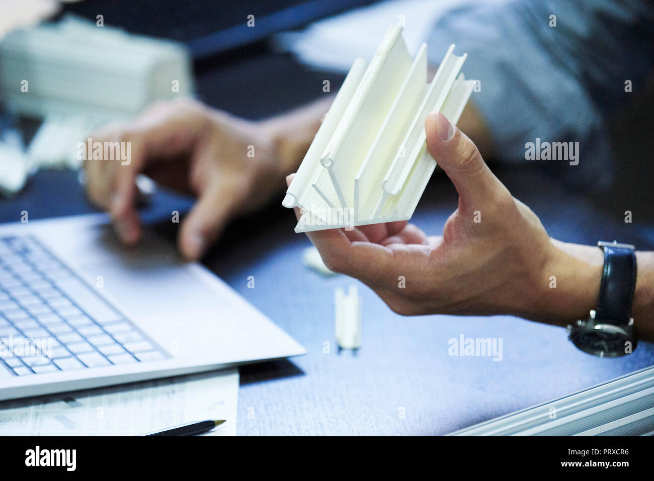 Engineer using laptop in office Stock Photo