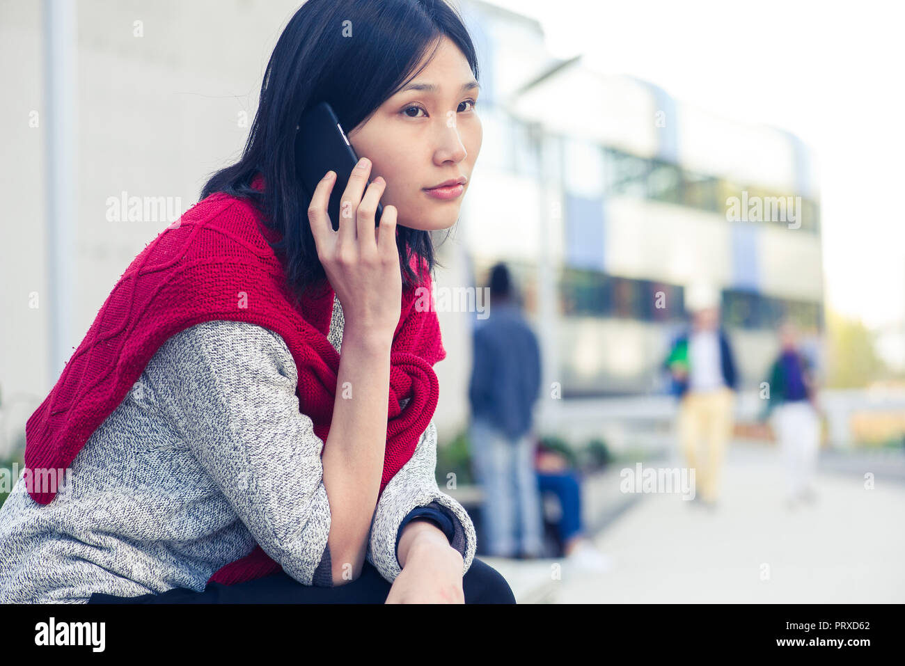 Young woman talking on smartphone Stock Photo