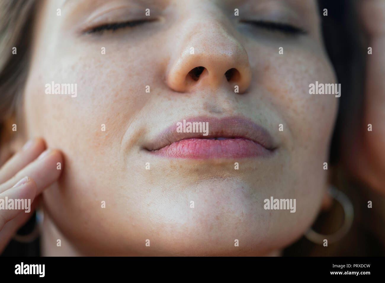 Woman eyes closed touching hi-res stock photography and images - Alamy
