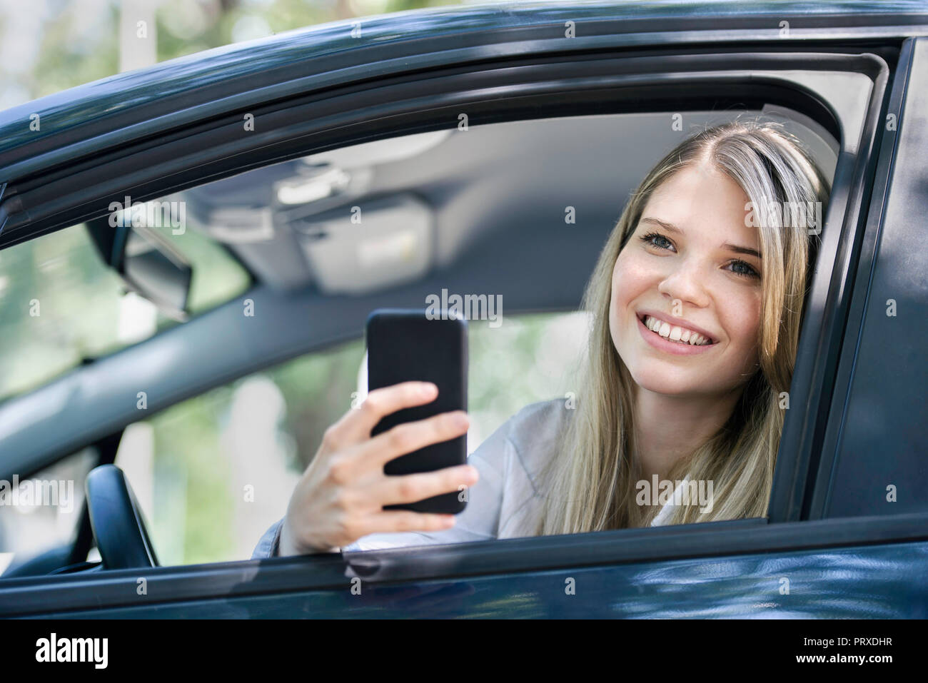 Photograph young woman sitting hi-res stock photography and images - Alamy
