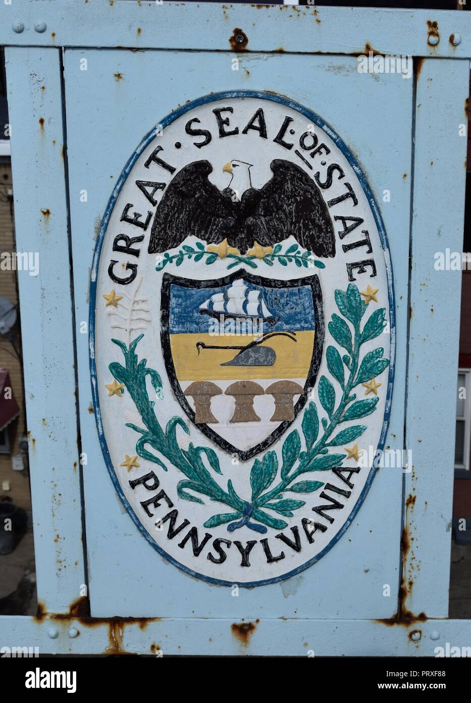 Public art in the form of great seals of the 13 original colonies along with Allegheny County found emblazoned and painted on the 40th Street Bridge Stock Photo