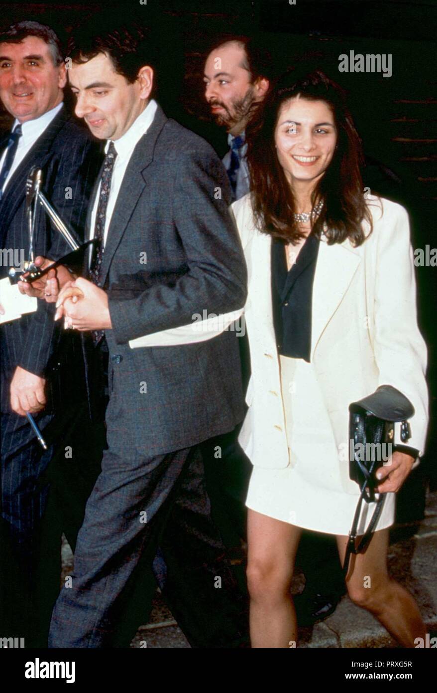 rowan atkinson and his wife sunetra sastry the couple have been married since 1990 and have two children picture by credit lmk mediapunch ref lmk11 lib98 190205 captioned 19th february 2005 credit lmk mediapunch PRXG5R