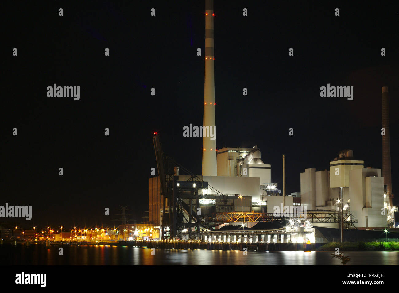 Bremen ports night Stadtwerke with lights energy for the city coal power plants Stock Photo