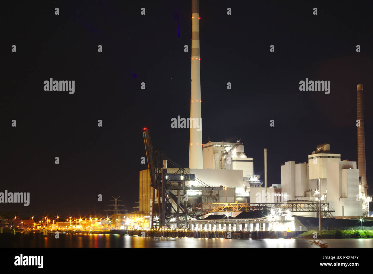 Bremen ports night Stadtwerke with lights energy for the city coal power plants Stock Photo