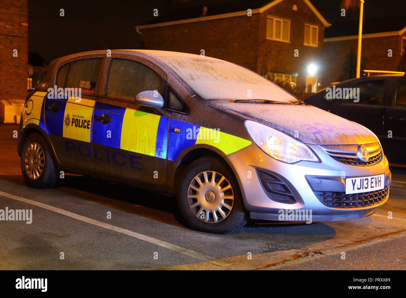 A parked police car covered in frost at Rossington Police Station in Doncaster, South Yorkshire Stock Photo