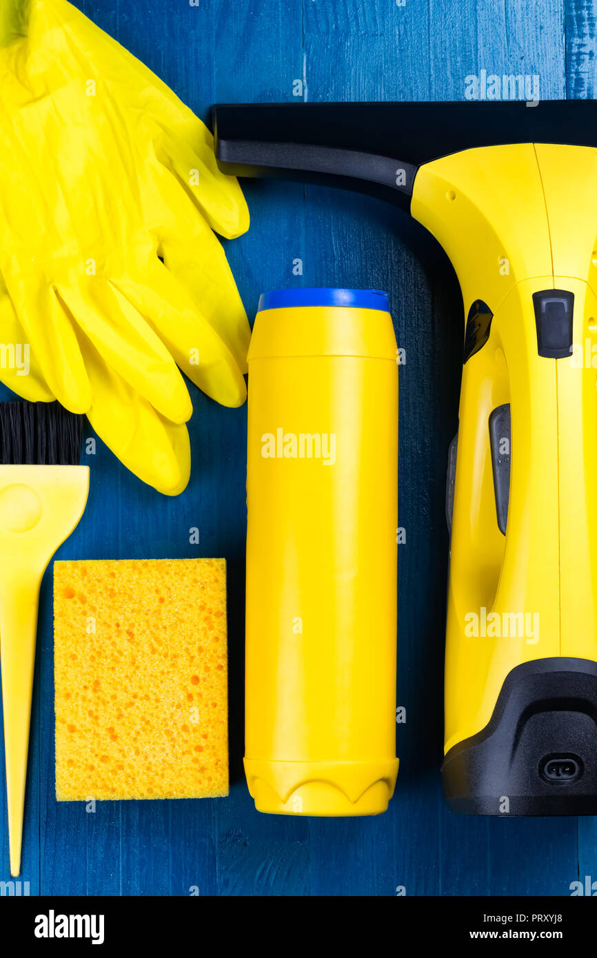 Yellow cleaning supplies on a blue
