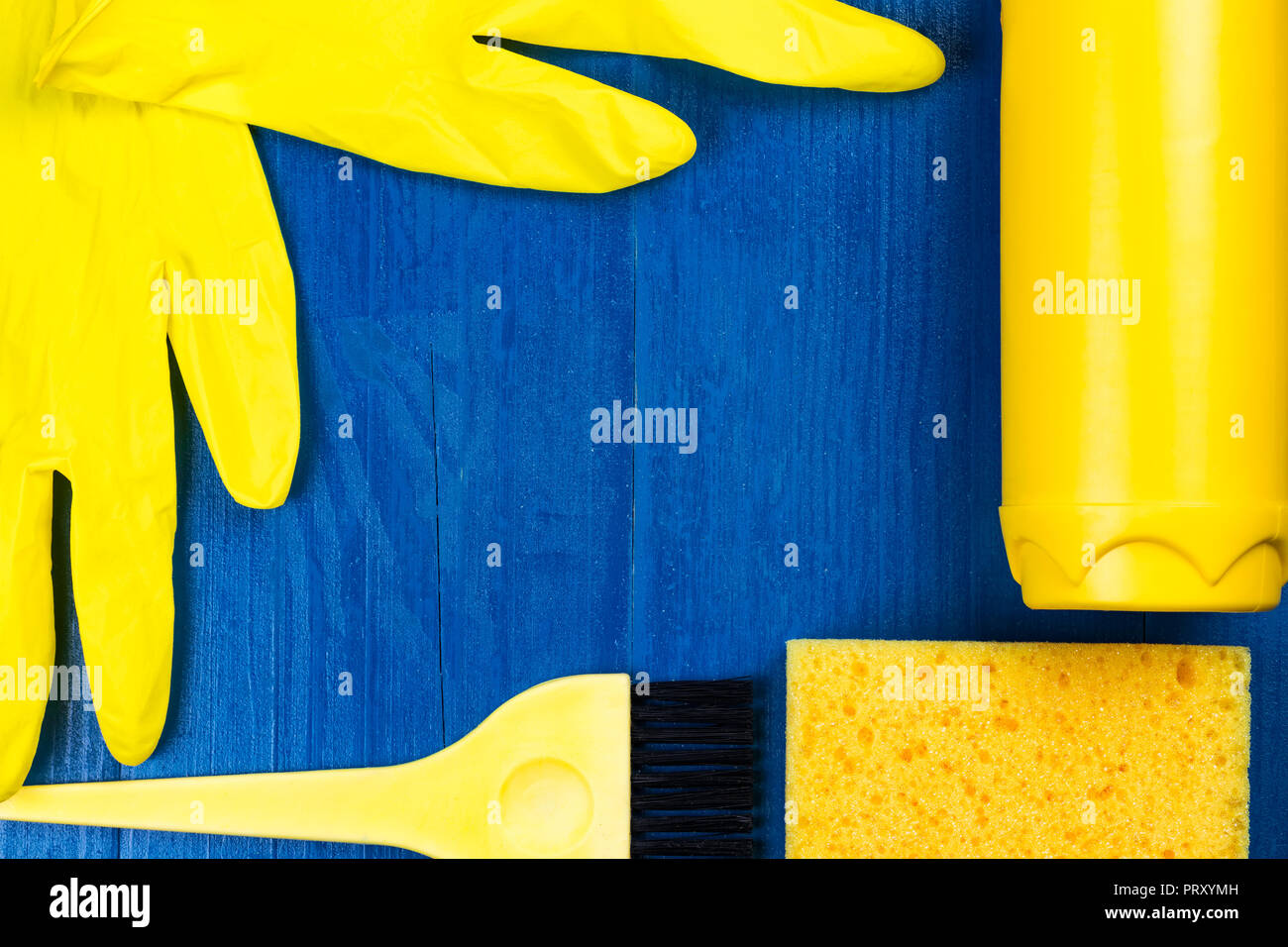 Yellow cleaning supplies on a blue