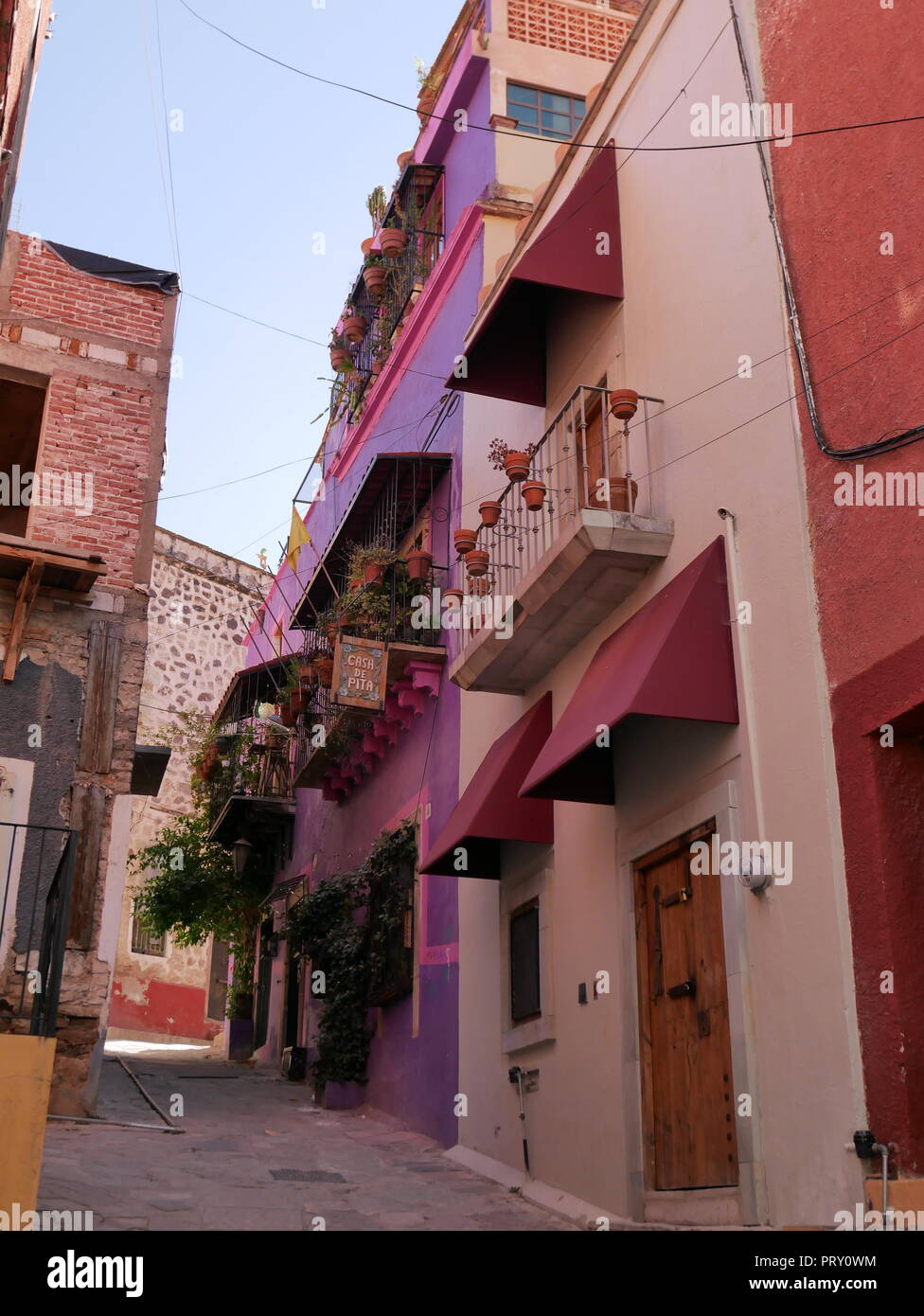 Narrow alley among colorful traditional houses in Guanajuato City