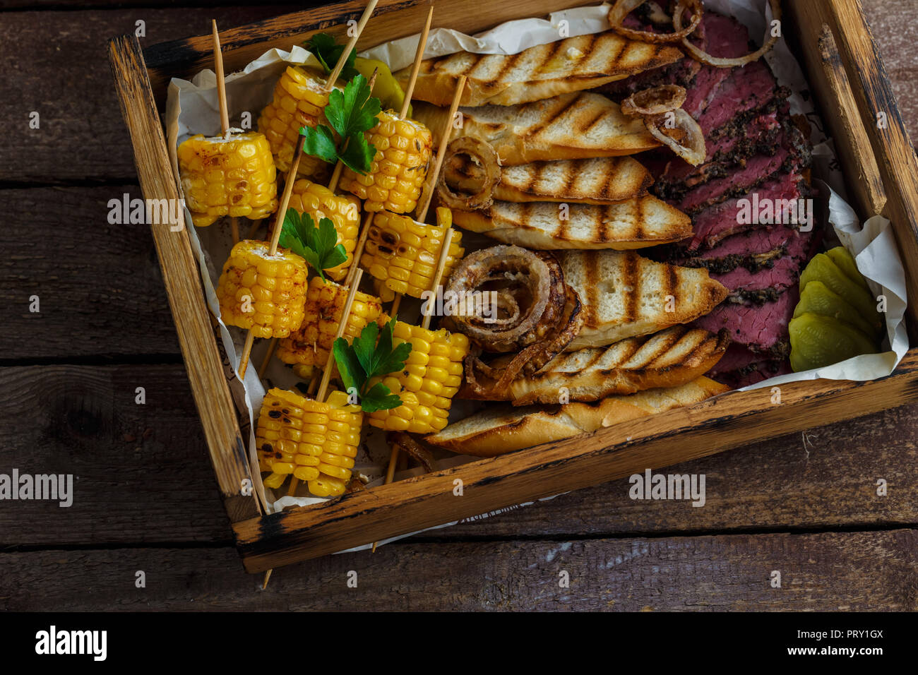 Delicious pastrami with toasted bread and corn Stock Photo Alamy