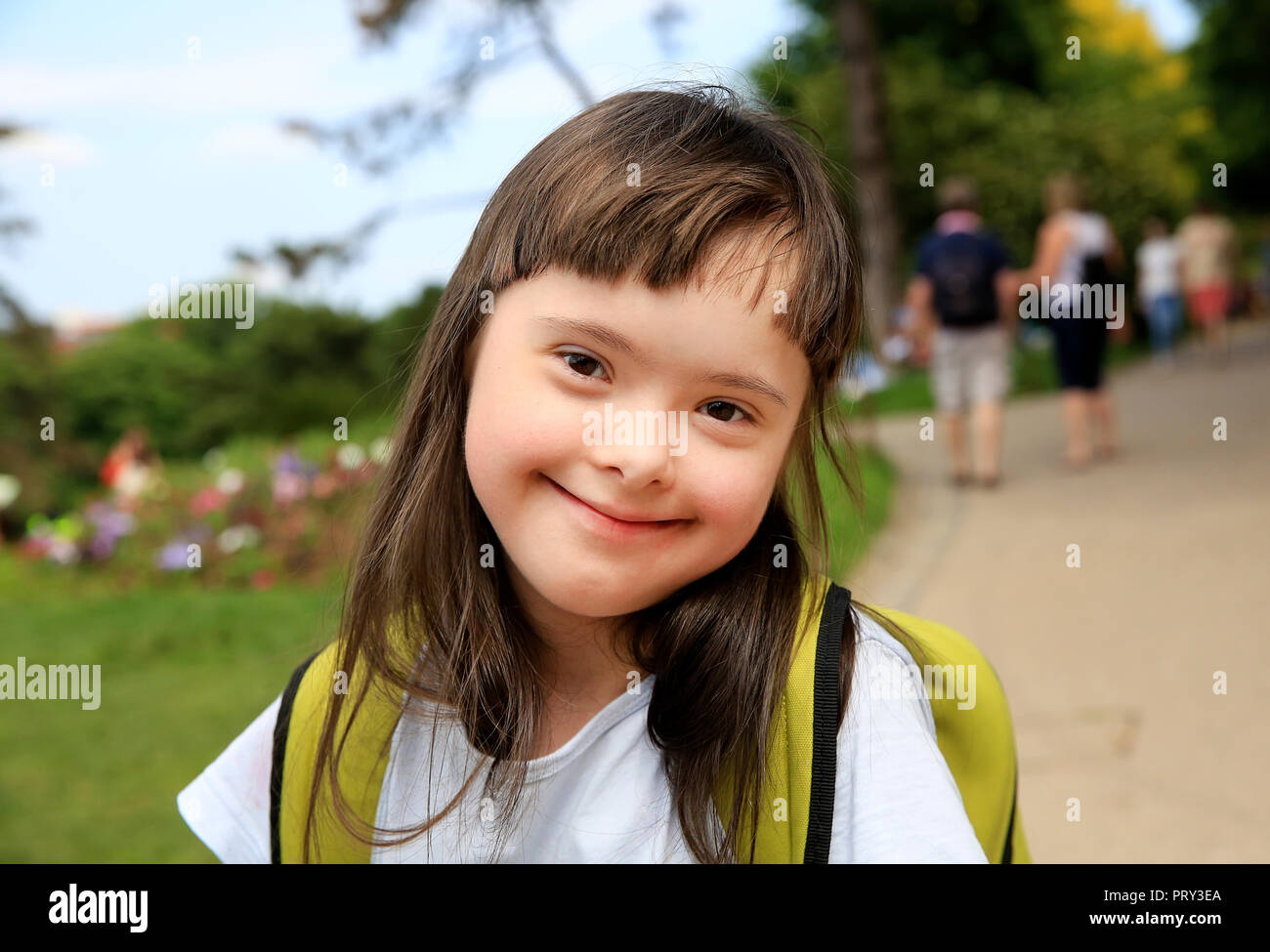 Portrait of little girl smiling in the park Stock Photo - Alamy