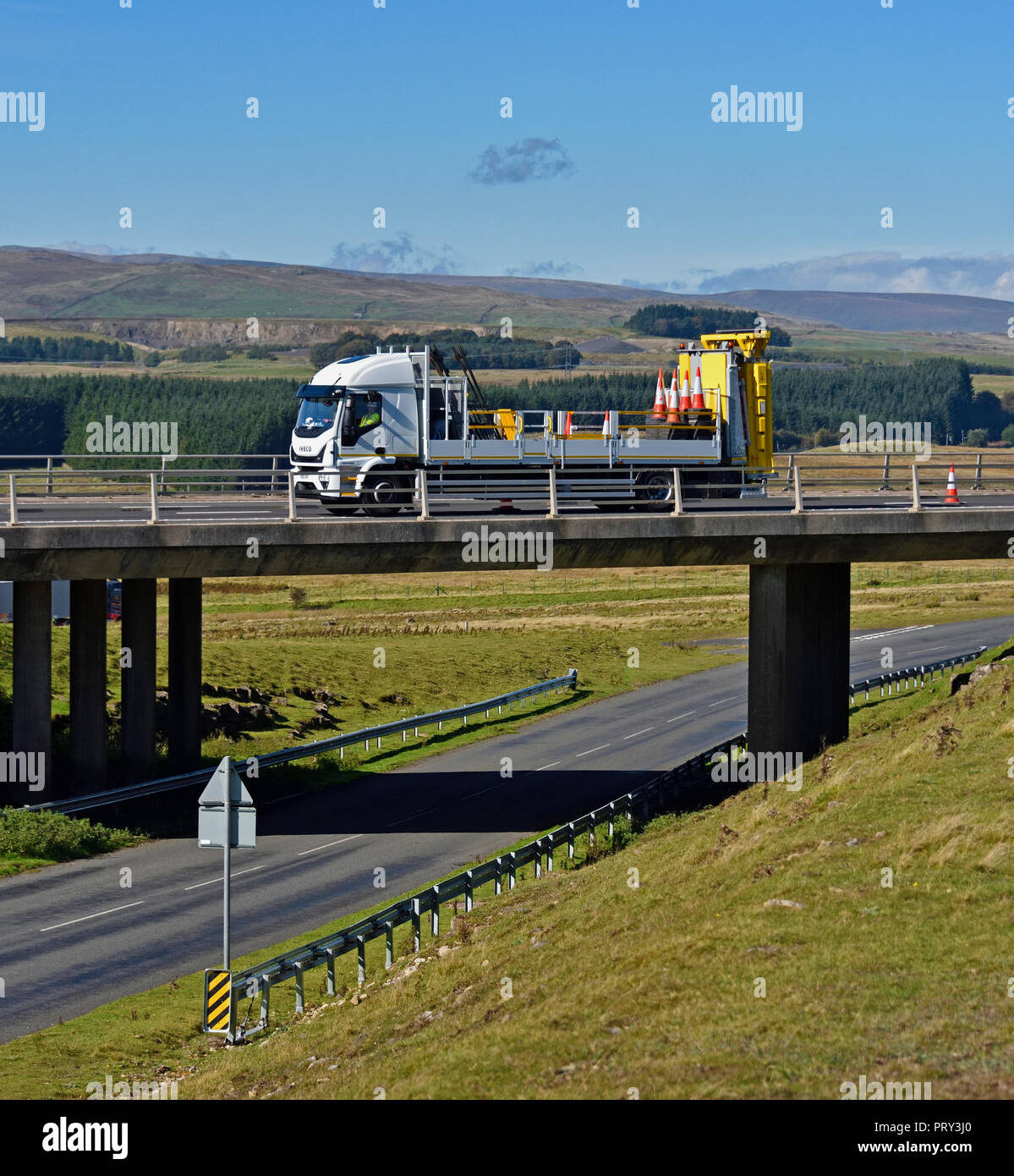 Motorway maintenance vehicle on bridge. M6 Southbound carriageway, Shap, Cumbria, England, United Kingdom, Europe. Stock Photo
