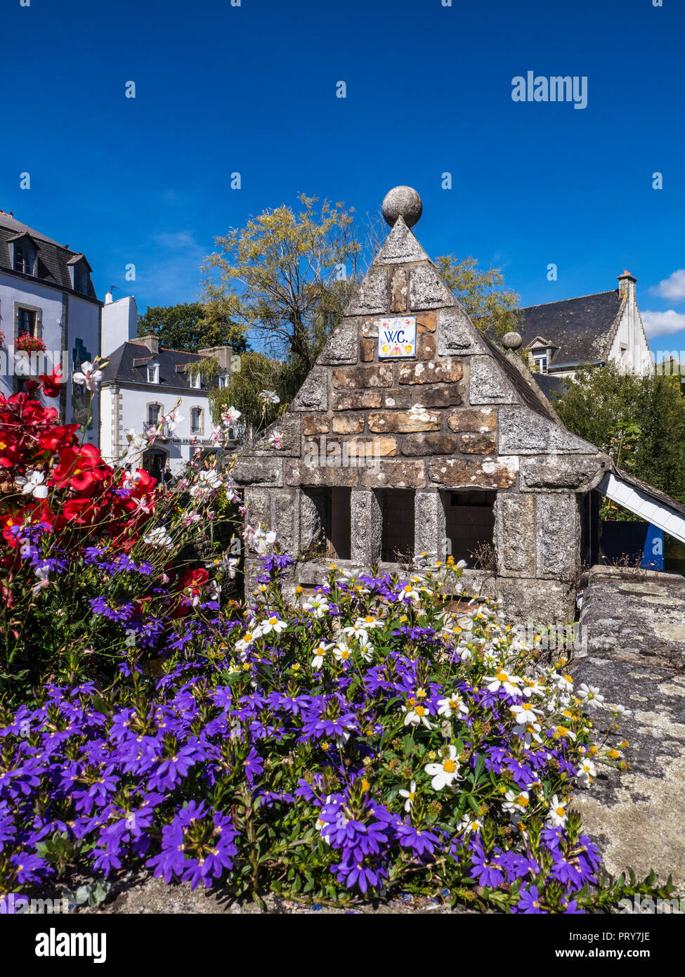 Pont Aven Historic quirky notable small stone WC lavatory toilet building on the banks of the River Aven in Pont-Aven Brittany France Stock Photo