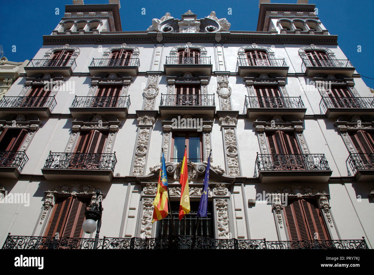 Flags on the facade of historical building in Valencia, Spain Stock Photo
