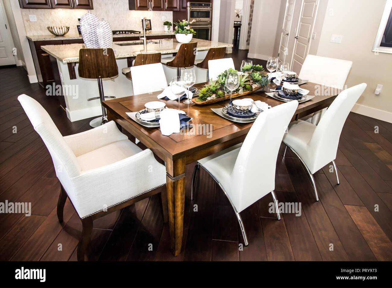 Dining Room Table And Chairs In Modern Kitchen Stock Photo - Alamy