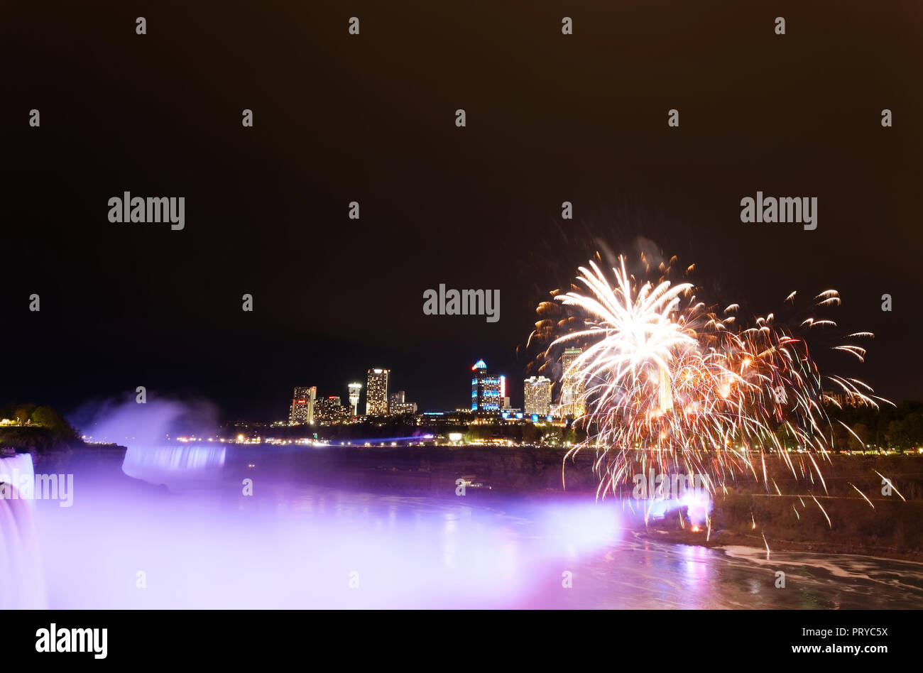 Niagara Falls at night and fireworks Stock Photo Alamy