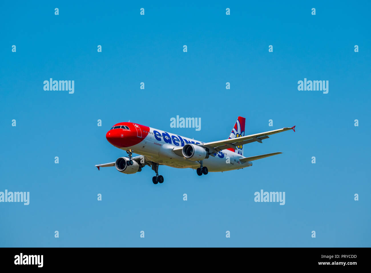 Edelweiss airlines airplane preparing for landing at day time in