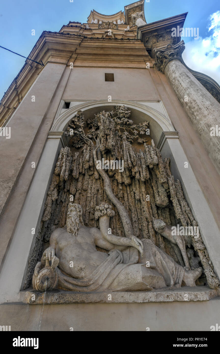 Fountain along Church of San Carlo alle Quattro Fontane by Francesco Borromini in Rome, Italy. Stock Photo