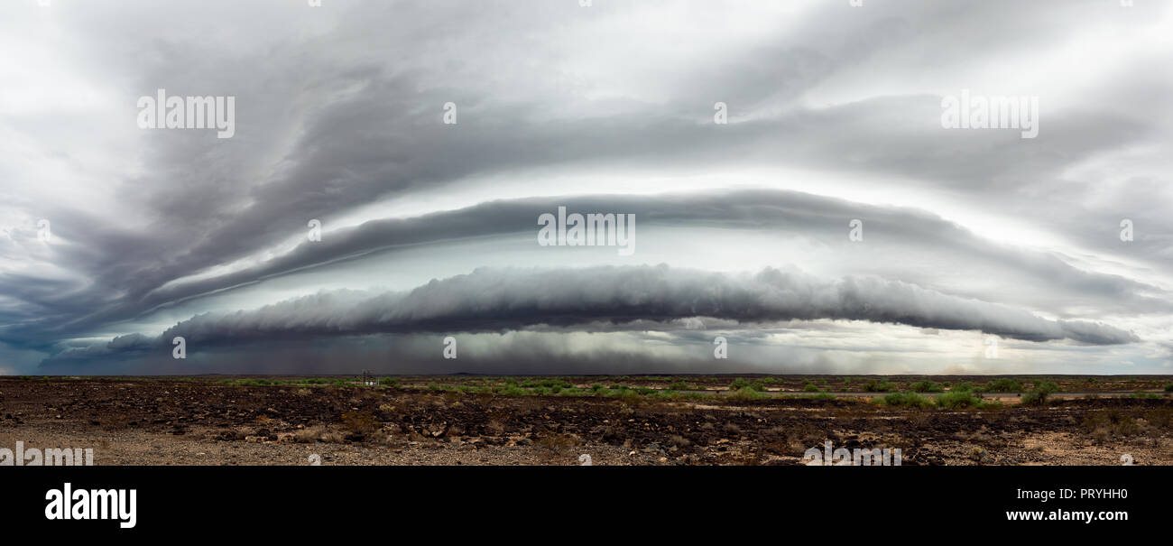 Panoramic view of a dramatic shelf cloud ahead of a storm near Gila Bend, Arizona as strong thunderstorms pushed across the desert. Stock Photo