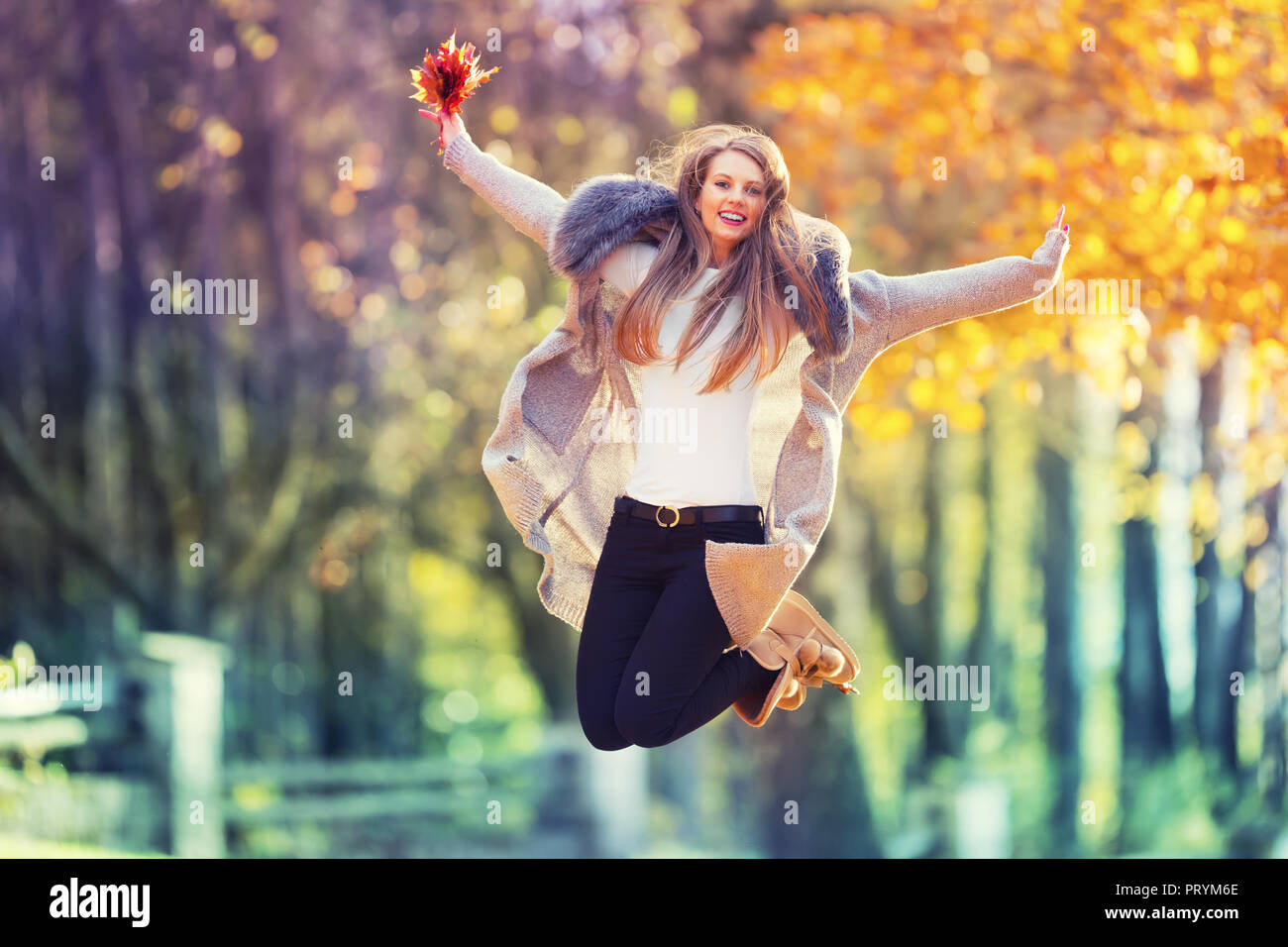 Happy woman jumping hi-res stock photography and images - Alamy